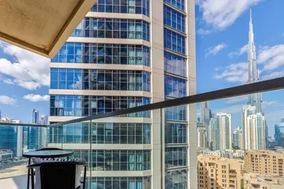 a view of a tall building from a balcony at Burj Khalifa View - 1BR in Bellevue Tower 2, Downtown - Allsopp & Allsopp in Dubai