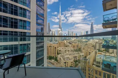 a view of a city from a balcony in a building at Burj Khalifa View - 1BR in Bellevue Tower 2, Downtown - Allsopp & Allsopp in Dubai