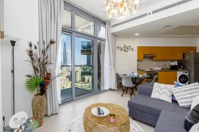 a living room with a couch and a table at Burj Khalifa View - 1BR in Bellevue Tower 2, Downtown - Allsopp & Allsopp in Dubai