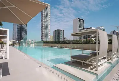 a swimming pool on the roof of a building at Bloomfeilds Royal 2Br Binghatti Onyx in Dubai