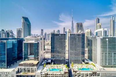 a view of a large city with many buildings at KeyRock Living - Stylish 1BR with Pool Access in Dubai