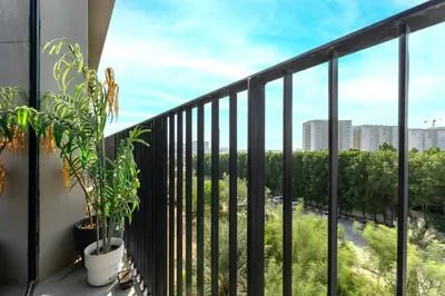 a balcony with a view of a city at HAVN - Studio in KOA Canvas, Access to Nasab Dubai in Dubai