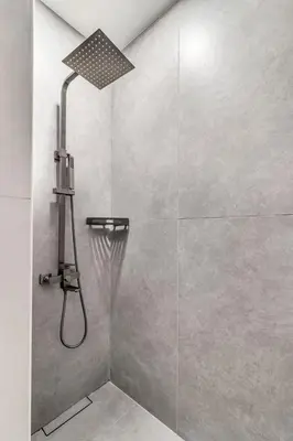 a shower with a shower head in a bathroom at GuestReady - Charming studio in Dubai Marina in Dubai