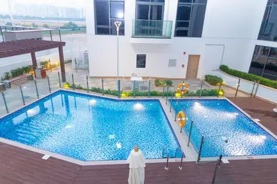 an overhead view of a swimming pool in a building at Bloomfields Modern 2br Azizi Gardens in Dubai