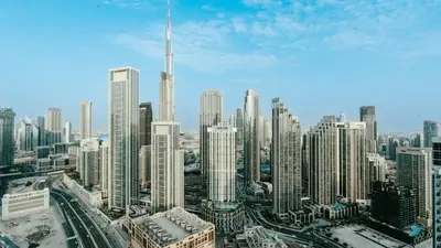 a view of a large city with tall buildings at 3BR Paramount Downtown - Burj Khalifa View in Dubai