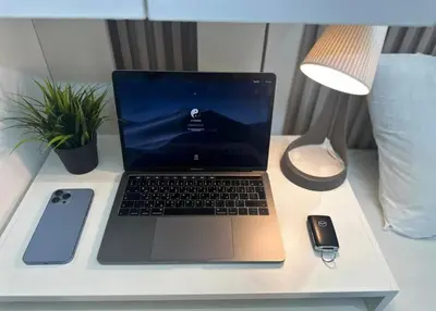 a laptop computer sitting on top of a desk at Contemporary Room in Barsha Heights Tecom Near ICM Metro in Dubai