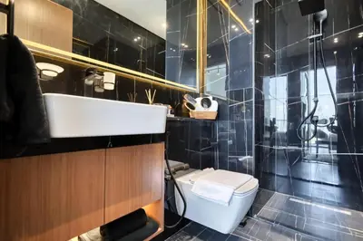 a bathroom with a toilet and a sink and a shower at Stunning Studio in Binghatti House in Dubai