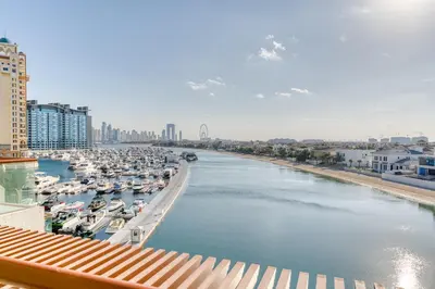 a view of a marina with boats in the water at Starfish Palm Views Studio in Dubai