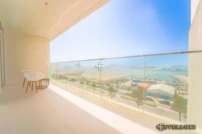 a large balcony with a view of the ocean at Chill 1br W Beach Views & Private Beach Access in Dubai