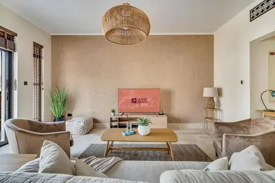 a living room with a couch and a table at GuestReady - Downtown retreat with city views in Dubai