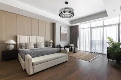 a bedroom with a large bed and a large window at SIMPLY COMFORT Apartments at Nobles Tower Luxury Burj View in Dubai