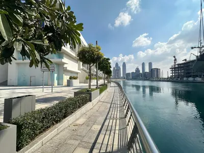 a view of a river with a city in the background at Luxury Jumeirah canal front designer stay sleeps4 in Dubai