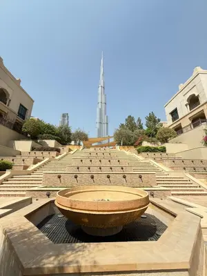 a large bowl sitting in the middle of a group of seats at Souk Al Bahar Dubai Fountain and Burj Khalifa view from the Balcony, 2 mins walk to Dubai Mall by Norbu Holiday Homes in Dubai