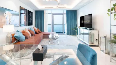 a living room with a couch and a tv at KeyRock Living - Luxe Retreat at Paramount in Dubai