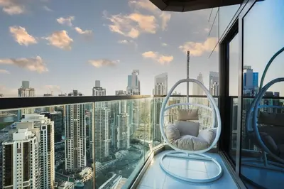 a room with a view of a city skyline at 5 Star Stay, Infinity Pool with Burj Khalifa Views in Dubai