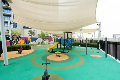 a playground with a slide and a play structure at Keyrock Living - Exclusive Luxury at Aykon Tower in Dubai
