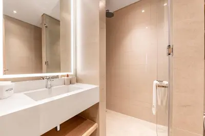 a bathroom with a sink and a shower at Serene 2BRplus1 Haven in Oakley JVC - 5star Amenities in Dubai