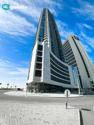 a large office building with a tall building at HiGuests - Stylish 1BR Retreat with Modern Interiors in Dubai in Dubai