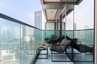 a room with a view of a city at UrbanStays Dubai - Paramount Midtown in Dubai