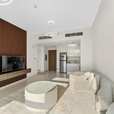 a living room with a couch and a table at 016 - Dubai Hills in Dubai