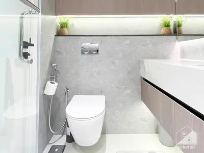 a bathroom with a toilet and a shower and a sink at Luxurious Studio in Arjan With Balcony & Views in Dubai