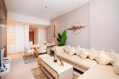 a living room with a couch and a table at Elite Royal Apartment - Panoramic Burj Khalifa View - Sky Edition - Luxurious - Zacharyas in Dubai