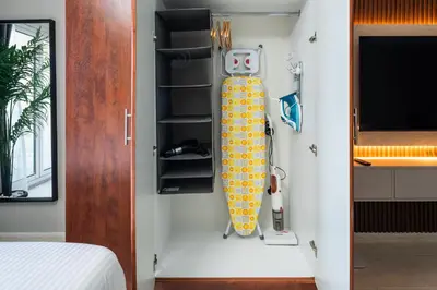 a room with a surfboard hanging from a wall at Luxury JLT Studio Lake View Metro 5minMarina in Dubai