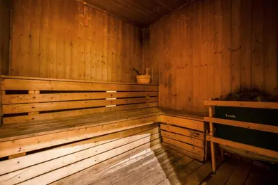 an empty wooden sauna with a plant in it at Luxury JLT Studio Lake View Metro 5minMarina in Dubai