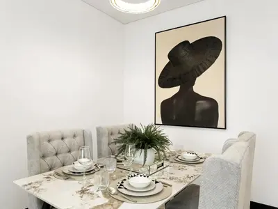 a dining room table with a hat on the wall at Huge Lux 1BHK in Prime Business Bay with Private Jacuzzi in Dubai