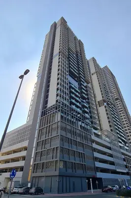 a tall building with a lot of windows at HAVN - New Studio Apartment in Bloom Towers, JVC in Dubai