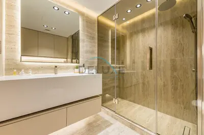 a bathroom with a sink and a shower at Sea and Palm Jumeirah Views Just Steps from the Beach 2BR, Sadaf 6 , JBR by Deluxe Holiday Homes in Dubai
