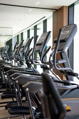 a row of chairs in a gym at Comfortable 1br Jvc Balcony Parking in Dubai