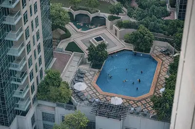 an overhead view of a swimming pool in a building at Breathtaking Views & Contemporary Comfort in the Heart of Downtown in Dubai