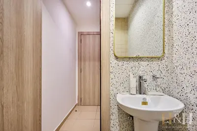 a bathroom with a sink and a mirror at Stunning views of Dubai Sea, Dubai Eye & JBRWalk in Dubai