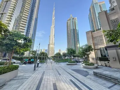 a street in a city with tall buildings at Act One Act Two - Exquisite One Bed in Downtown in Dubai