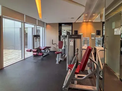 a gym with cardio equipment in a building at Frank Porter - Damac Majestine in Dubai