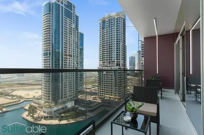 a view of a city from the balcony of a building at Elegant 1-Bedroom with Stunning Lake View in JLT in Dubai