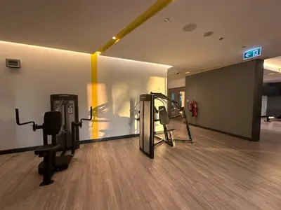 a gym with cardio equipment in a room at Park View Stay at Creek Horizon in Dubai