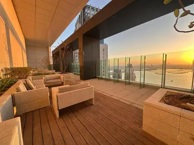 a balcony with couches and a view of the ocean at Park View Stay at Creek Horizon in Dubai