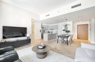 a living room with a couch and a table at Apartment Downtown Dubai in Dubai