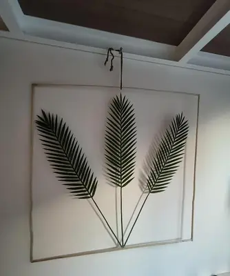 a framed picture of a plant on a wall at Stylish Boutique Loft Duplex, Near Circle Mall, Balcony, Fast WiFi, 2 Pools and Gym in Dubai