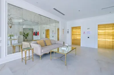 a living room with a couch and a table at Livbnb-Modern Living 1B Apartment in JVC in Dubai