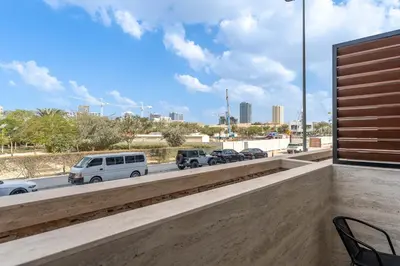 a view of a highway with cars parked on the road at Urban Studio With Pool & Tennis Court in Dubai