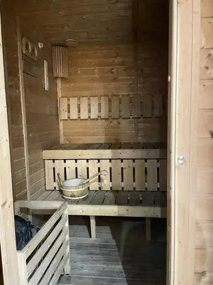 an inside of a sauna with a bowl on a bench at Lake & Beach view Studio in the Center of Marina in Dubai