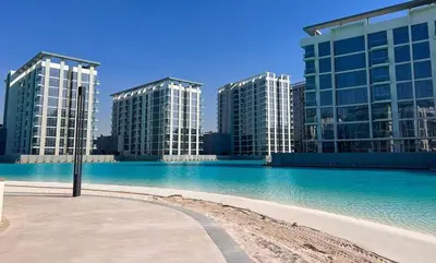 a view of two tall buildings with blue water at Stylish Escape in Meydan 1B Polo Residence C3 in Dubai