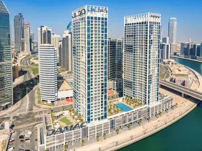 an aerial view of a city with tall buildings at Vogue Business Bay Damac Maison Prive near Burj Khalifa and Dubai Mall, Studio Apartment with Canal and City View, Access to all Amenities in Dubai