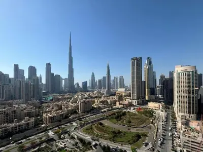 an aerial view of a city with tall buildings at Vogue Business Bay Damac Maison Prive near Burj Khalifa and Dubai Mall, Studio Apartment with Canal and City View, Access to all Amenities in Dubai