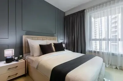 a bedroom with a large bed and a window at Near Burj Khalifa, Dubai Fountain view, Dubai Mall in 10 mins walk in Dubai