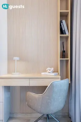 a desk with a blue chair in a room at HiGuests - Modern & Stylish 1BR Apt - Near Business Bay Metro in Dubai