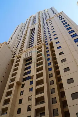 a tall building with many windows on it at High Floor 2BR With a View of the Dubai Marina Canal Steps Away From the Beach , Shams 1, JBR by Deluxe Holiday Homes in Dubai
